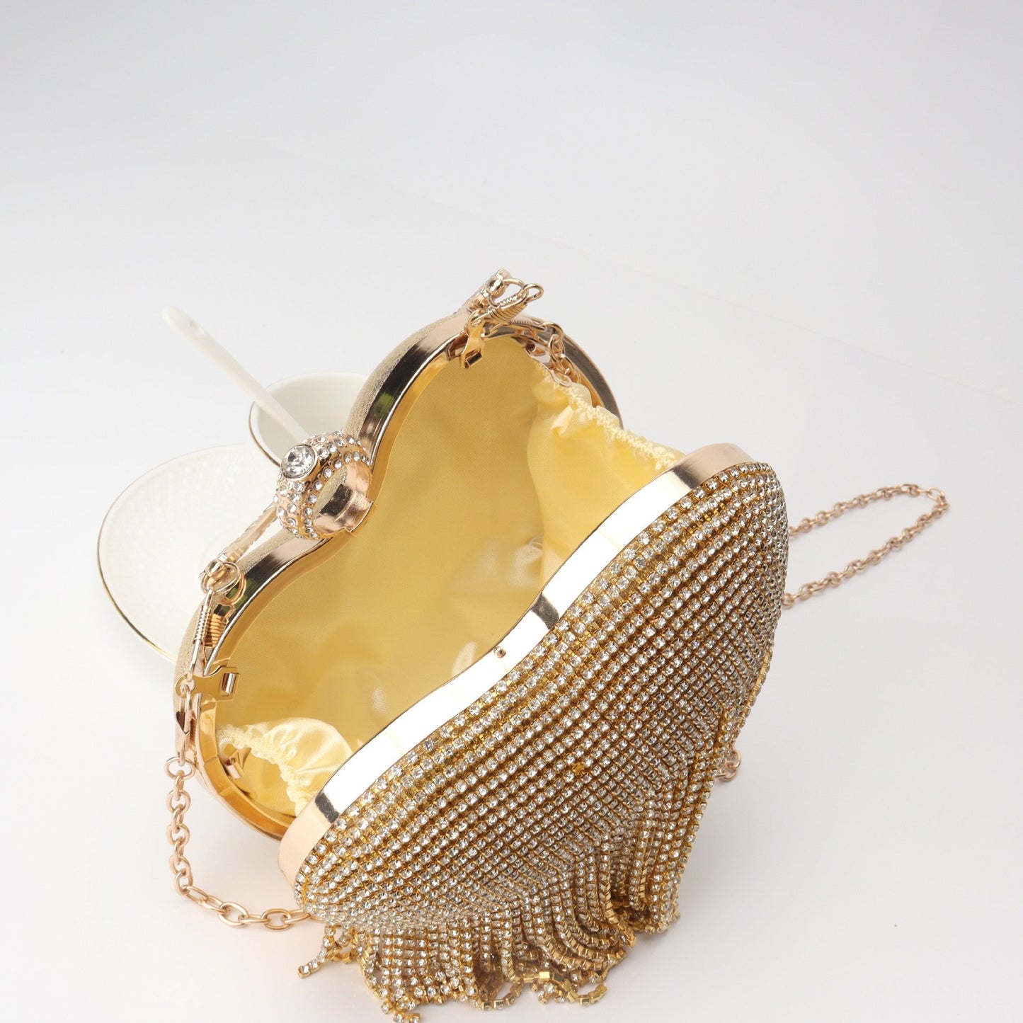 The Queen's Fringed Rhinestone Heart Clutch