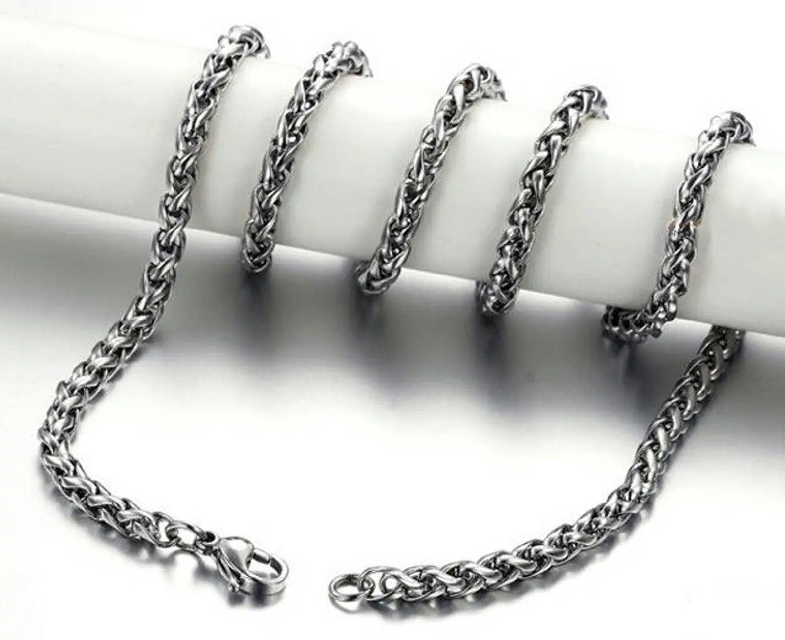 Silver chain necklace on a white background